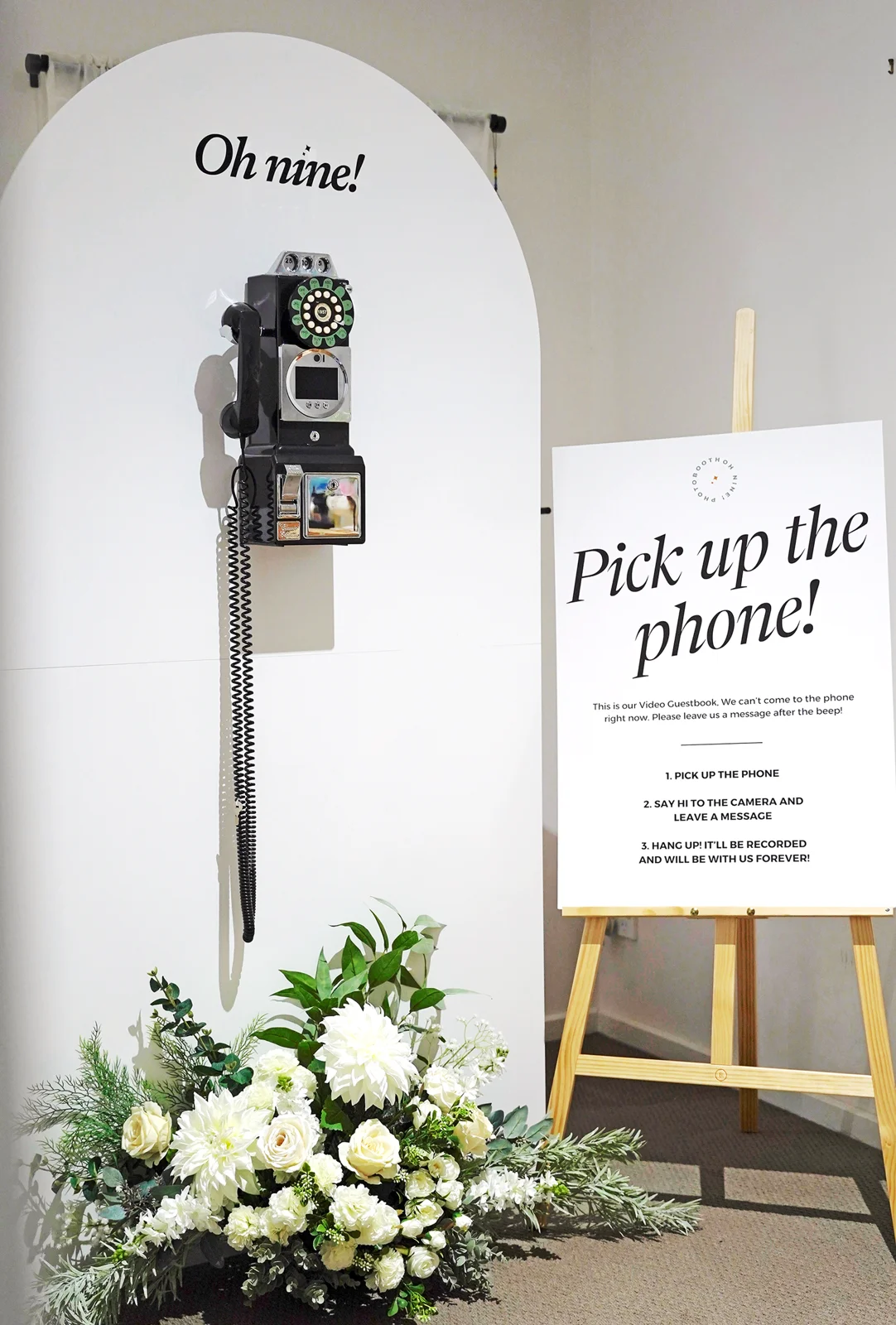 Vintage video guestbook styled with flowers at an event